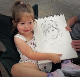 street portrait of a child in charcoal